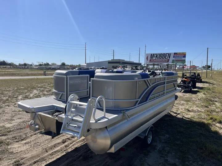 Slide: The Image of 2024 Bennington S 20 SSR pontoon boat on a trailer in a dealership lot. - 7