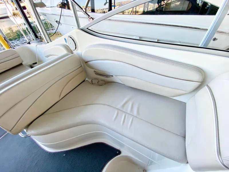Slide: The Image of 2008 Larson Cabrio 240 boat interior with beige leather seating. - 11