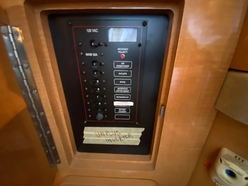 Slide: The Image of 2008 Larson Cabrio 240 electrical control panel with labeled switches. - 19