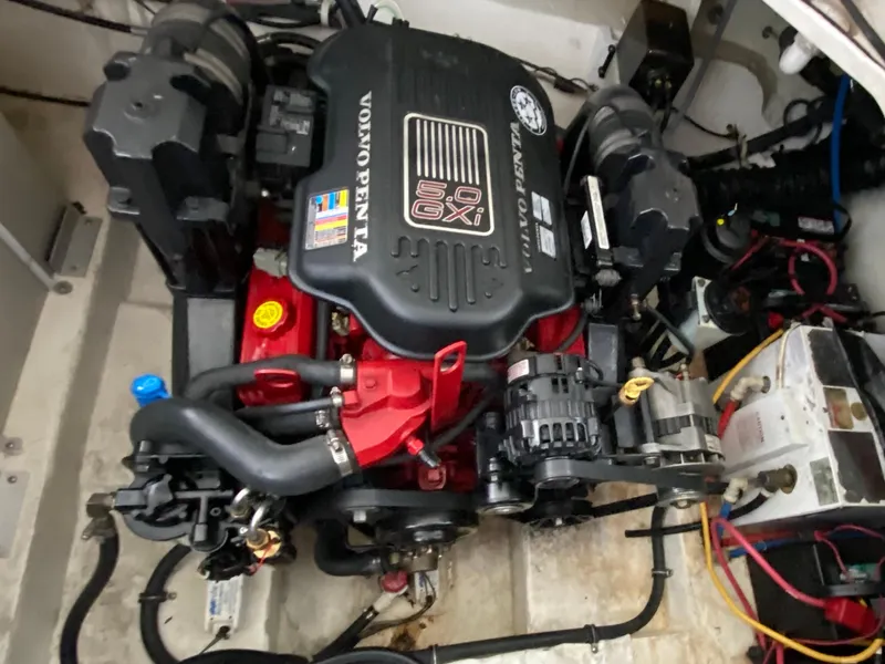 Slide: The Image of 2008 Larson Cabrio 240 engine compartment featuring a Volvo Penta 5.0 GXI engine. - 23