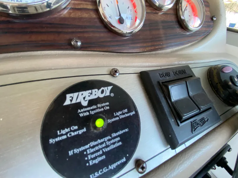Slide: The Image of Control panel of a 2008 Larson Cabrio 240 boat with Fireboy system. - 26