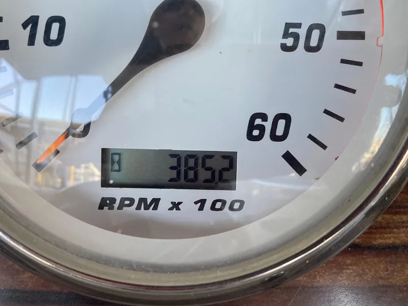 Slide: The Image of Close-up of 2008 Larson Cabrio 240 tachometer showing 3852 RPM. - 9