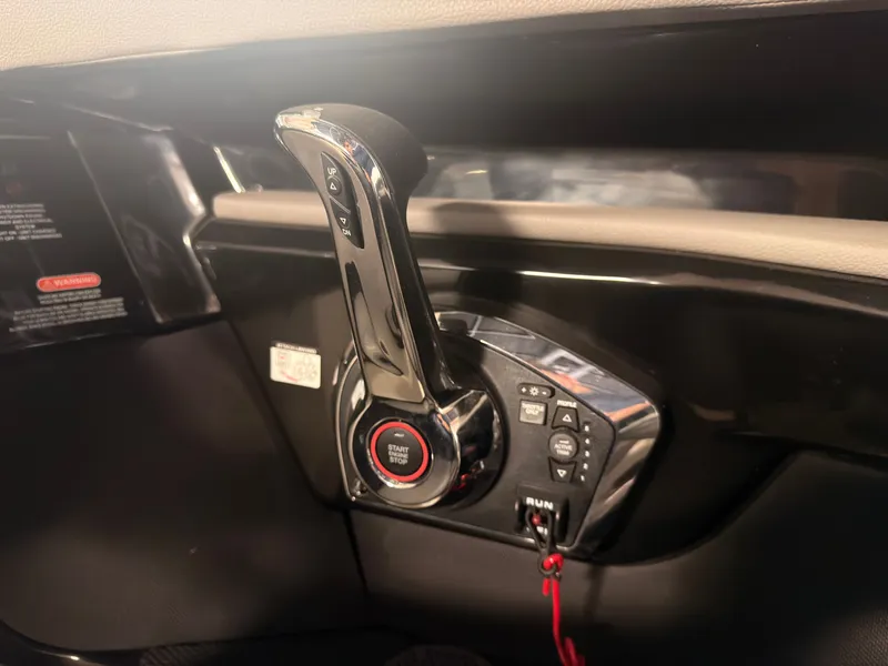 Slide: The Image of Close-up of the throttle lever on a 2024 Sea Ray SLX 260 Surf. - 38