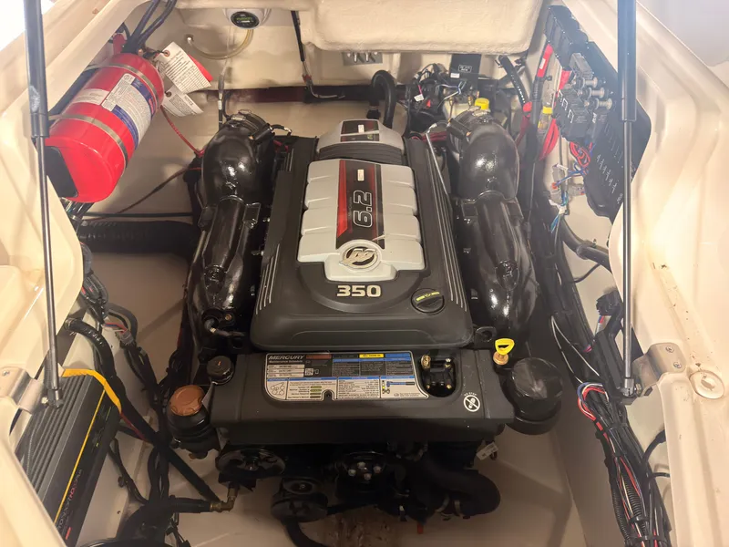 Slide: The Image of The engine compartment of a 2024 Sea Ray SLX 260 Surf features a 6.2-liter, 350 HP engine. - 18