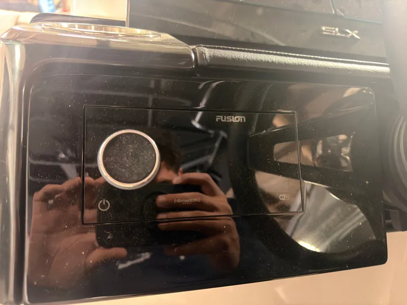 Slide: The Image of Close-up of a Fusion audio system on a Sea Ray SLX 260 Surf boat. - 35