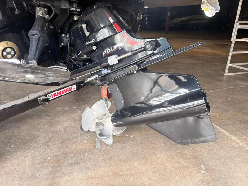 Slide: The Image of Close-up of a boat propeller and drive system in a garage. - 6