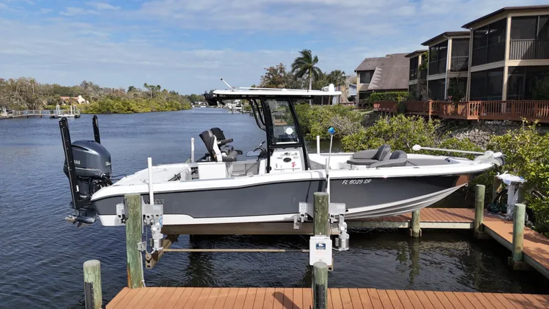 Slide: The Image of 2020 Crevalle 26 HCO Yamaha 300 boat docked, top view. - 1