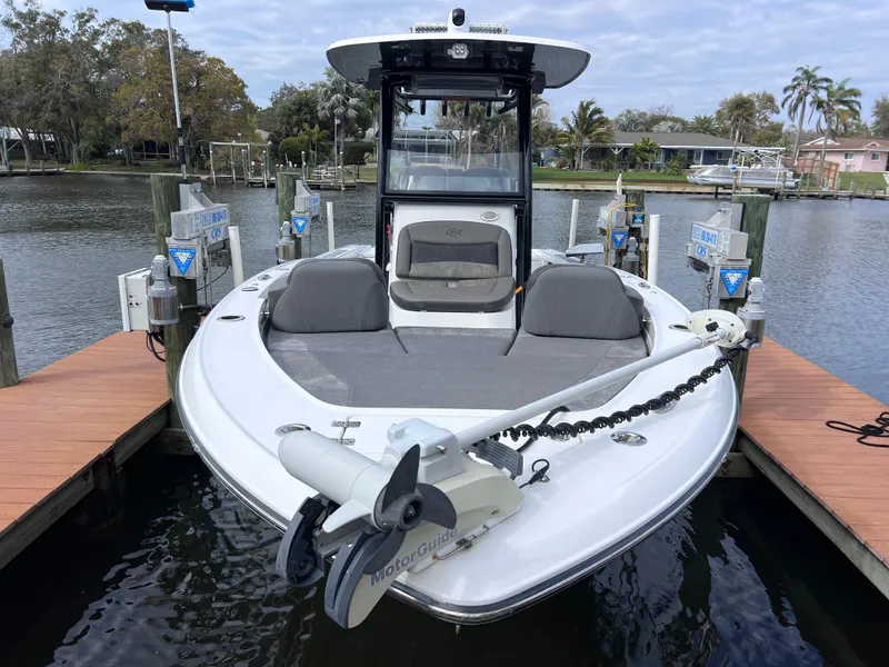 Slide: The Image of 2020 Crevalle 26 HCO Yamaha 300 boat docked, front view with trolling motor. - 14