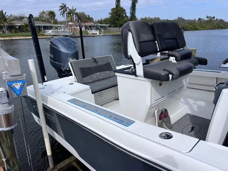 Slide: The Image of 2020 Crevalle 26 HCO Yamaha 300 boat docked, featuring comfortable seating and modern design. - 17