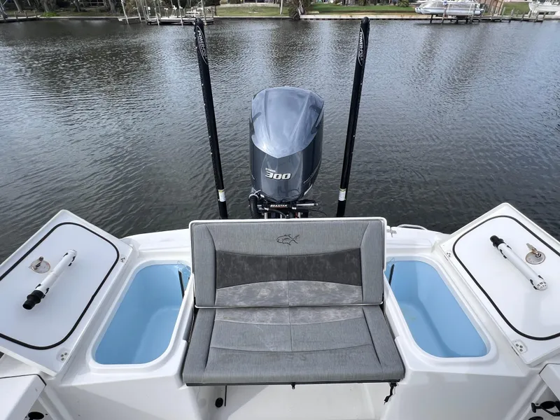 Slide: The Image of 2020 Crevalle 26 HCO Yamaha 300 boat stern with seating and storage compartments. - 21
