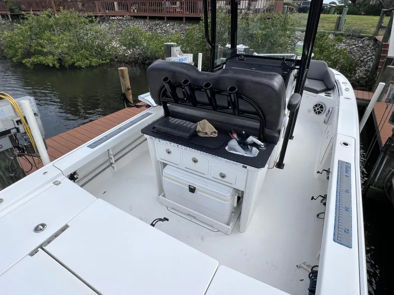 Slide: The Image of 2020 Crevalle 26 HCO Yamaha 300 boat interior with seating and storage. - 24