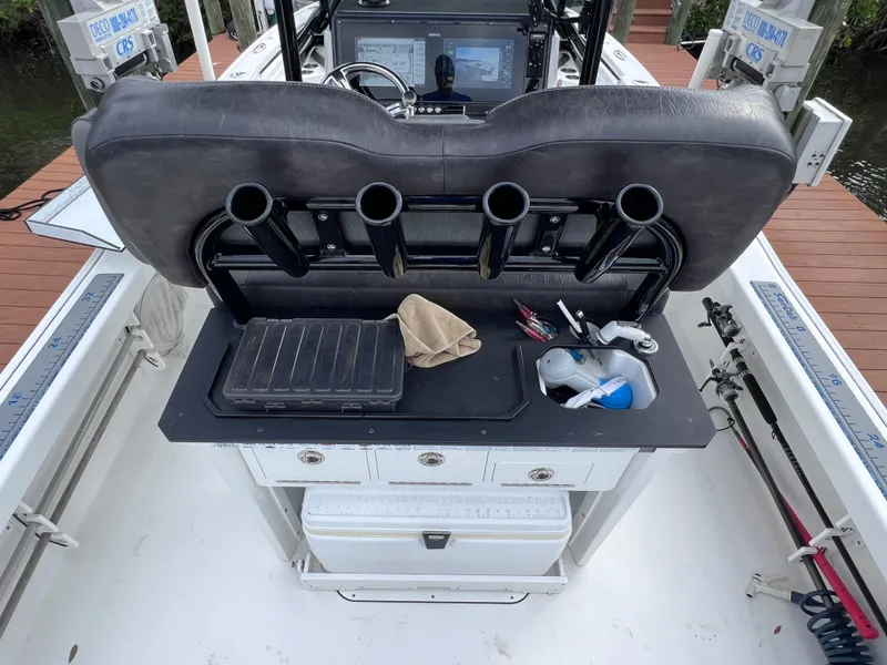 Slide: The Image of 2020 Crevalle 26 HCO Yamaha 300 boat with fishing rod holders and storage compartments. - 26
