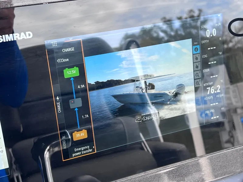 Slide: The Image of Simrad display on 2020 Crevalle 26 HCO Yamaha 300 boat showing navigation and charge status. - 29