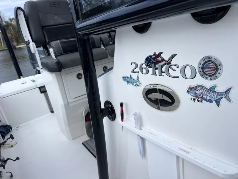 Slide: The Image of 2020 Crevalle 26 HCO Yamaha 300 boat interior with seating and decals. - 33