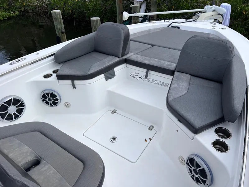 Slide: The Image of 2020 Crevalle 26 HCO Yamaha 300 boat with cushioned seating and speakers. - 39