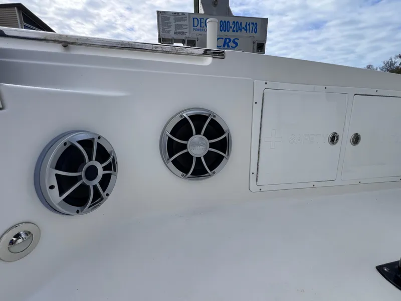 Slide: The Image of 2020 Crevalle 26 HCO Yamaha 300 boat speakers and storage compartments. - 42