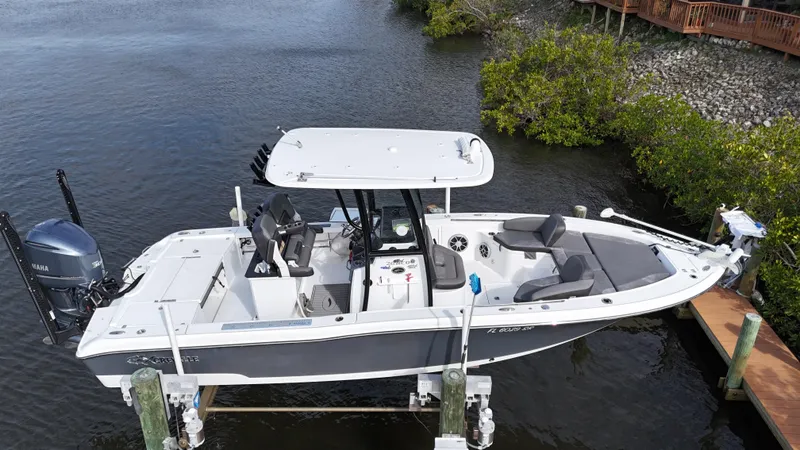 Slide: The Image of 2020 Crevalle 26 HCO Yamaha 300 boat docked on lift. - 6