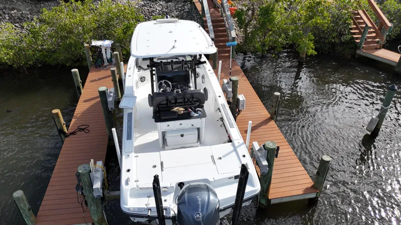 Slide: The Image of 2020 Crevalle 26 HCO Yamaha 300 boat docked at a marina. - 8