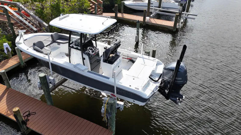 Slide: The Image of 2020 Crevalle 26 HCO Yamaha 300 boat docked on water. - 9