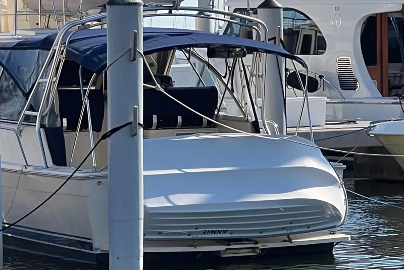Slide: The Image of 2005 Mainship Pilot 34 Rum Runner II docked at marina. - 21