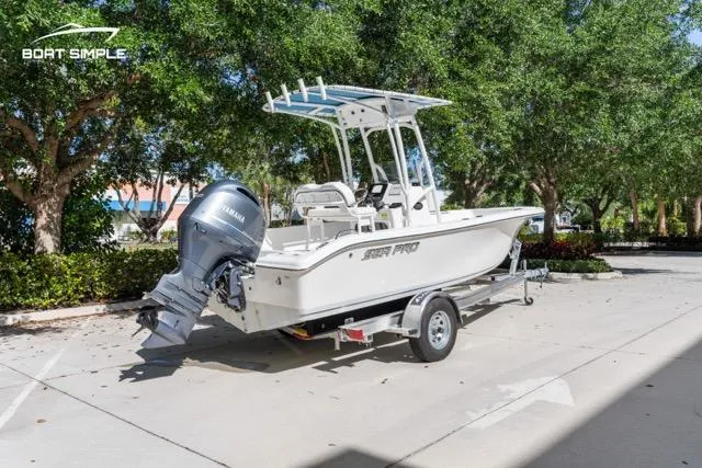 Slide: The Image of 2023 Sea Pro 199 Deep V Center Console boat on trailer, parked outdoors. - 7