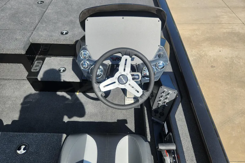 Slide: The Image of 2024 Vexus AVX2080 boat cockpit with steering wheel and control panel. - 4