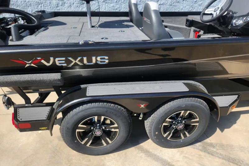 Slide: The Image of 2024 Vexus AVX2080 boat on a trailer with dual black wheels. - 6