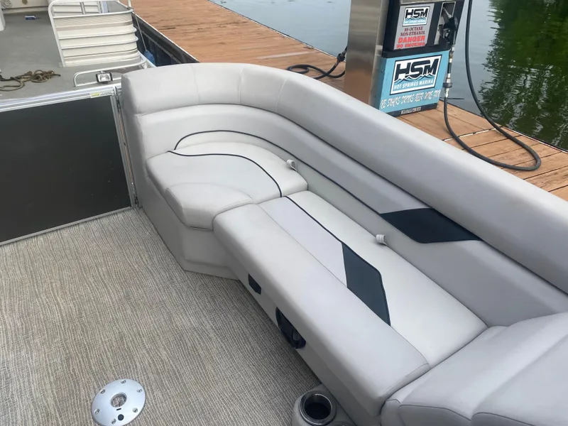Slide: The Image of 2022 SunCatcher Select 322RC pontoon boat with plush seating at dock. - 12