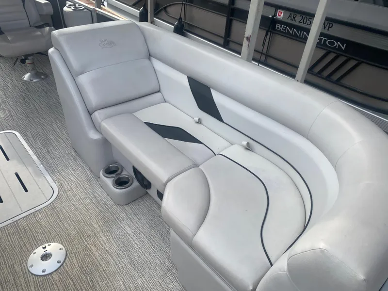 Slide: The Image of 2022 SunCatcher Select 322RC boat interior with plush seating and cup holders. - 4