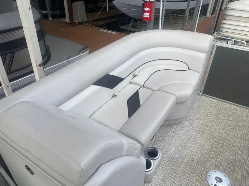 Slide: The Image of 2022 SunCatcher Select 322RC boat with comfortable seating and cup holders. - 8