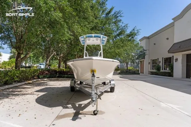 Slide: The Image of 2023 Sea Pro 199 Deep V Center Console boat on trailer, parked outdoors. - 5