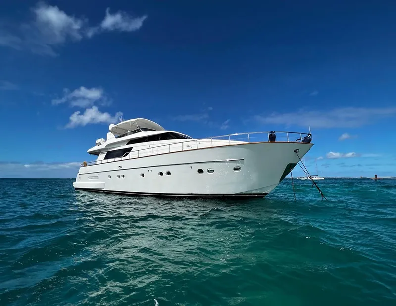 The Image of Sanlorenzo SL72 2006 yacht on clear blue ocean under sunny sky. - 0