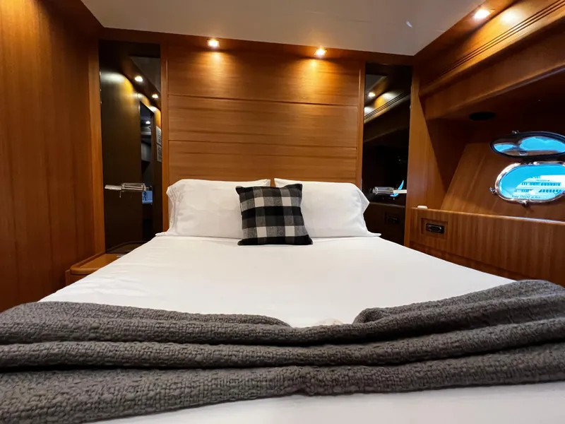 Slide: The Image of Luxurious bedroom interior of 2006 Sanlorenzo SL72 yacht with cozy bed and wooden finish. - 11