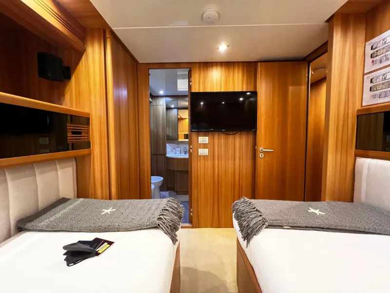 Slide: The Image of Luxury cabin interior of 2006 Sanlorenzo SL72 yacht with twin beds and TV. - 16