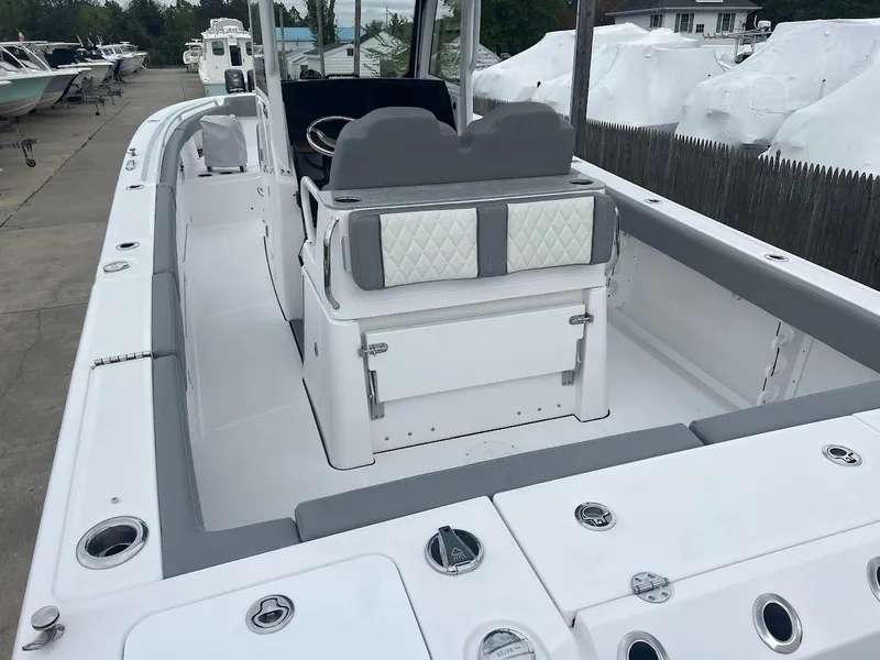 Slide: The Image of 2024 Everglades 285 Center Console boat interior with seating and storage. - 10