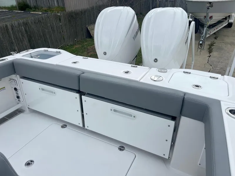 Slide: The Image of 2024 Everglades 285 Center Console boat with dual outboard engines. - 11