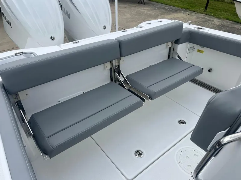 Slide: The Image of 2024 Everglades 285 Center Console boat with foldable rear seats. - 12