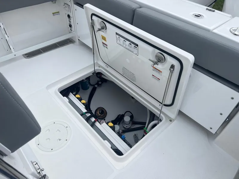 Slide: The Image of 2024 Everglades 285 Center Console boat with open hatch showing internal components. - 14