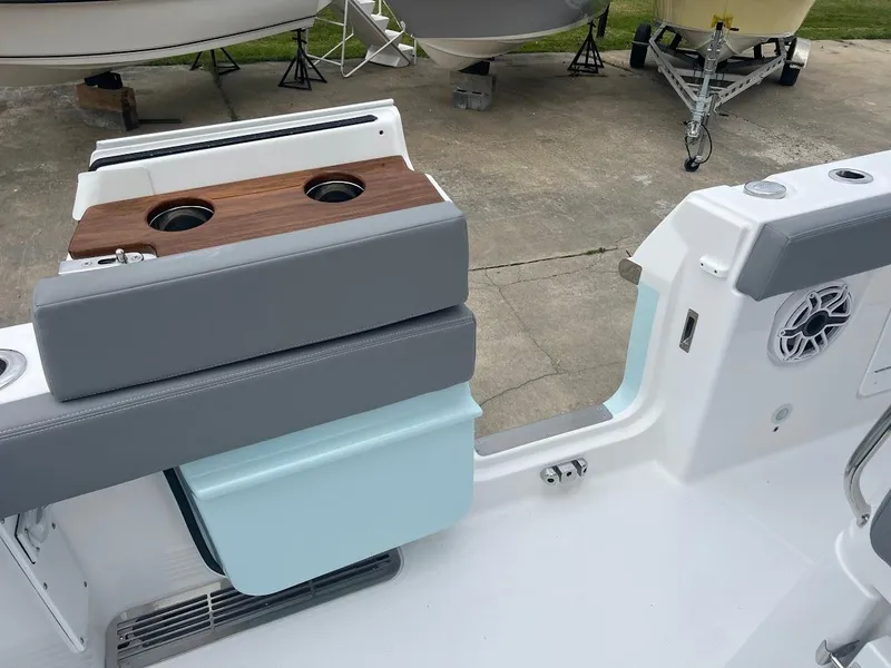 Slide: The Image of 2024 Everglades 285 Center Console boat interior with seating and cup holders. - 15