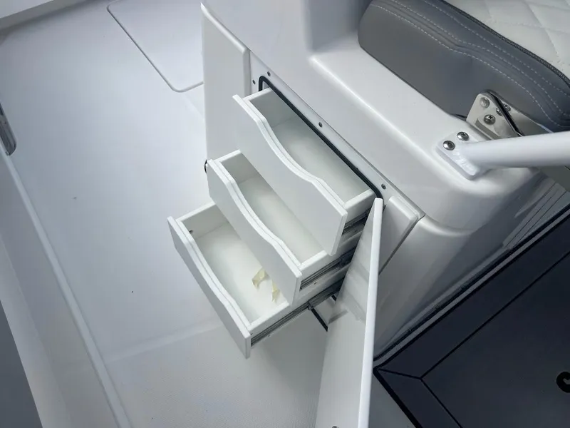 Slide: The Image of 2024 Everglades 285 Center Console boat with open storage drawers. - 18