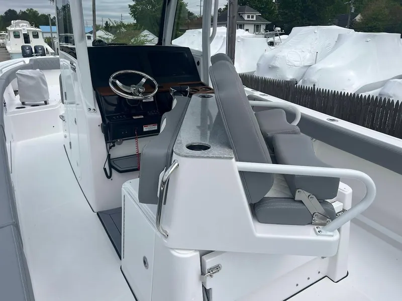 Slide: The Image of 2024 Everglades 285 Center Console boat interior with helm station and seating. - 20