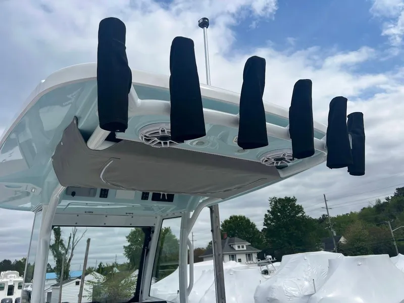 Slide: The Image of 2024 Everglades 285 Center Console boat with rod holders and overhead storage. - 25