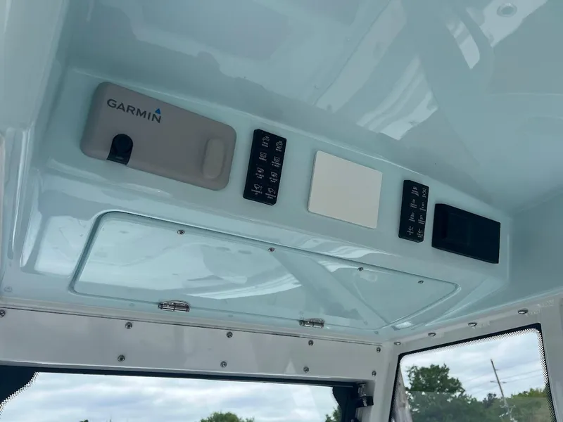 Slide: The Image of Overhead console of 2024 Everglades 285 Center Console boat with Garmin electronics. - 26