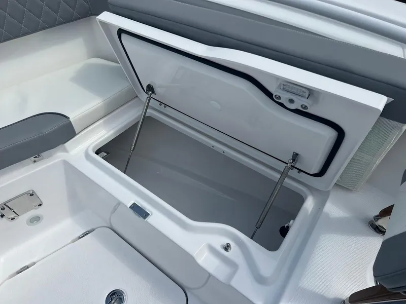 Slide: The Image of Open storage compartment on 2024 Everglades 285 Center Console boat. - 33