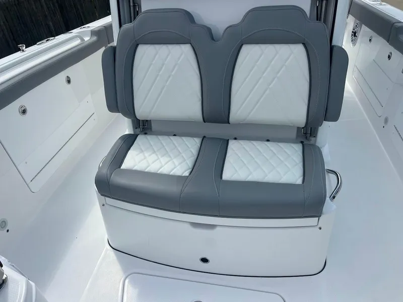 Slide: The Image of 2024 Everglades 285 Center Console boat with dual cushioned seats. - 34