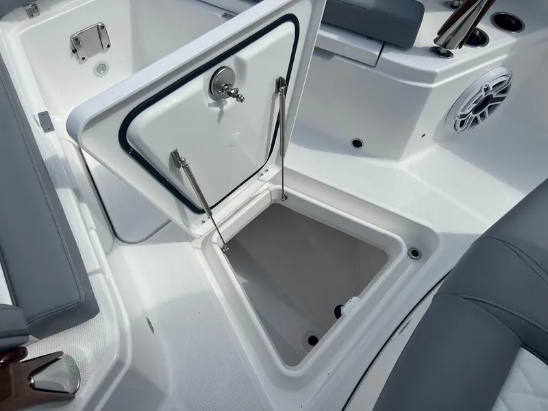 Slide: The Image of 2024 Everglades 285 Center Console boat with open storage compartment. - 36
