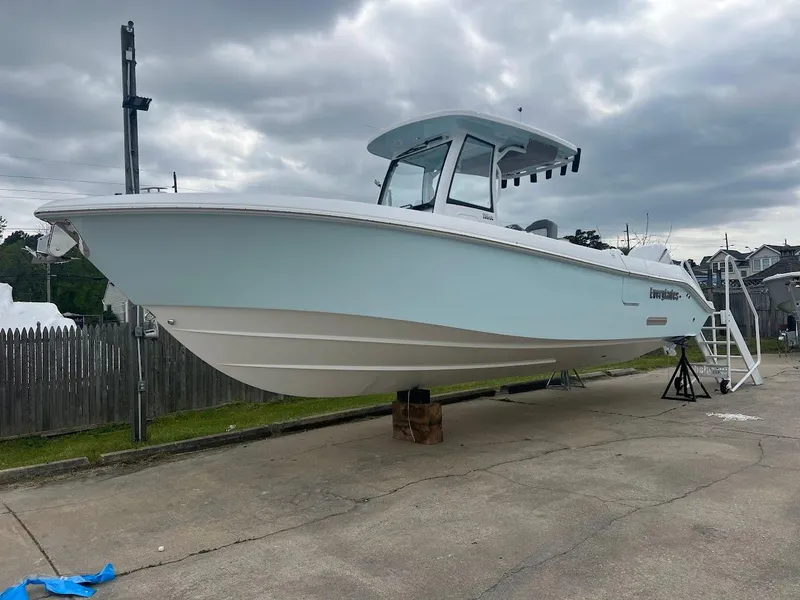 Slide: The Image of 2024 Everglades 285 Center Console boat on display outdoors. - 4