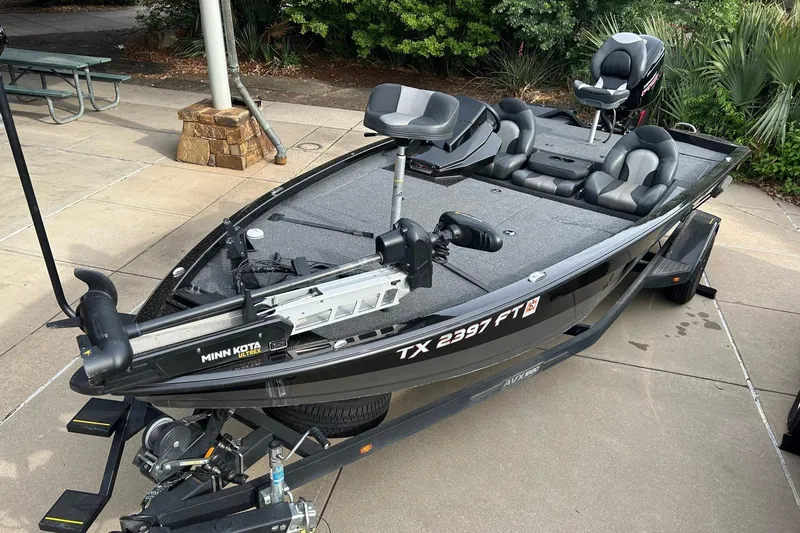 Slide: The Image of 2020 Vexus AVX1880 fishing boat with Minn Kota trolling motor on trailer. - 0