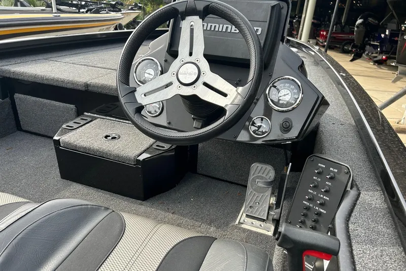 Slide: The Image of 2020 Vexus AVX1880 boat cockpit with steering wheel and control panel. - 1