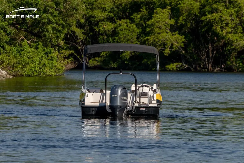 Slide: The Image of 2022 Starcraft SVX 191 OB boat on calm water with lush green trees in the background. - 3